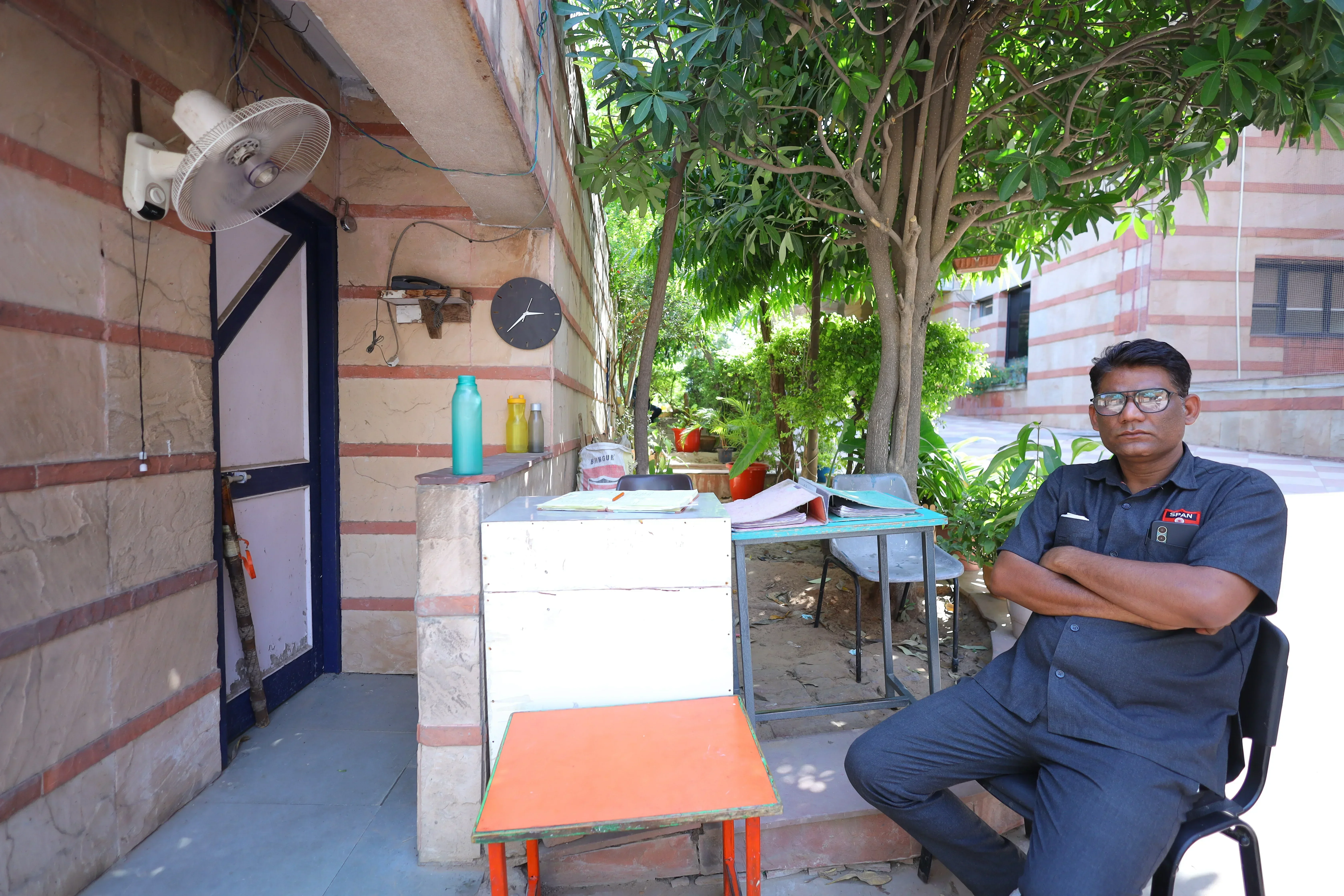 Security guard supervising school entry